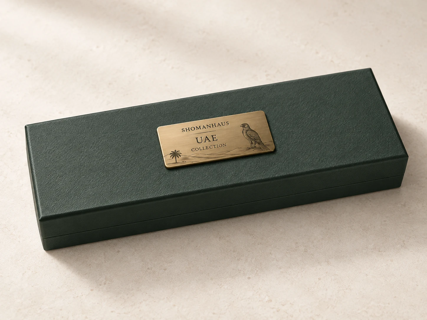 UAE Collection — forest-green SHOMANHAUS box with engraved brass falcon and dunes plaque